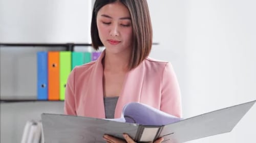 Young Asian business woman in office face portrait smile