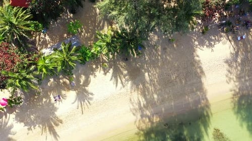 Aerial drone shot landscape of luxury sea view beach break by turquoise ocean with bright sandy back