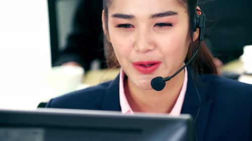 Business People Wearing Headset Working in Office