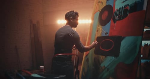 Artist Painting Large Canvas in Urban Studio