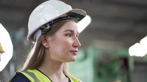 Woman in Hard Hat at Industrial Workplace