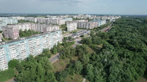 Aerial View MultiStorey Buildings Near Green Forest in Residential Area at City