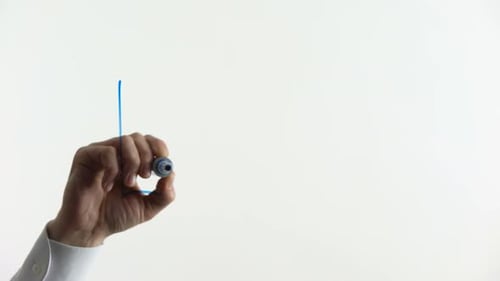 Hand Writes Login on Glass in Blue Marker