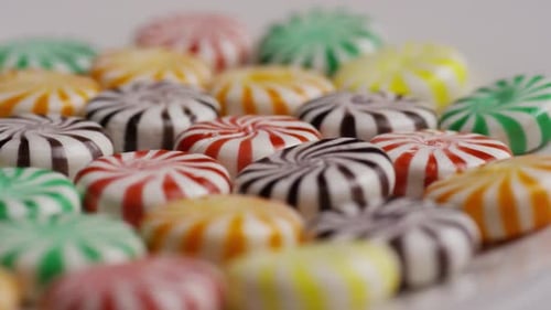 Rotating shot of a colorful mix of various hard candies - CANDY MIXED 029