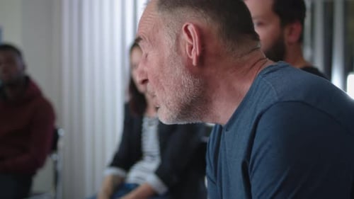 Adults in a Group Discussion Indoors