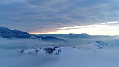 Aerial View in Foggy Sunset Winter Mountain