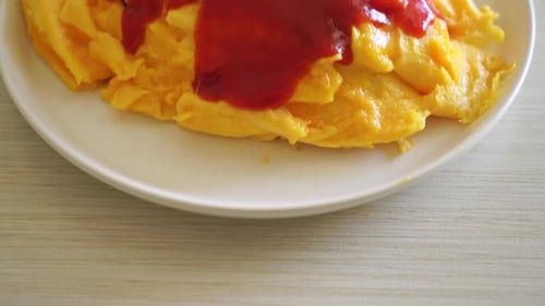 Creamy Omelet Topped with Tomato Sauce and Herbs