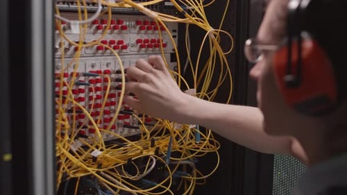 Maintenance Person Checking Wires