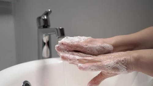 Hand Washing With Soap and Running Water