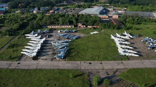Top view of the planes at the airfield. Many old, broken aircraft are at the airfield.