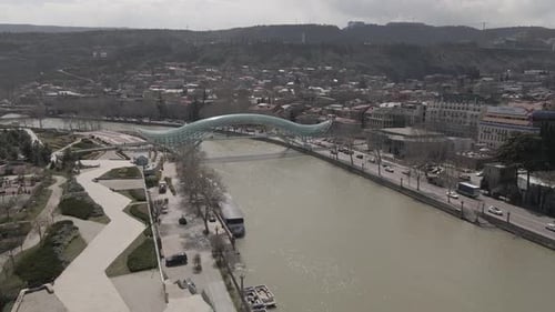 Tbilisi, Georgia - April 2 2021: Aerial view of Tbilisi city central park and Bridge of Peace.
