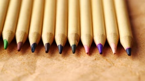 Close Up of Colorful Pencils on Notepad