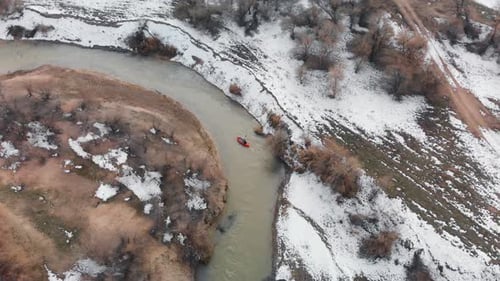 Man is Paddling on Raft Boat in the River