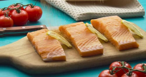 Cooking Concept. Seasoning Falling Onto Salmon Fish