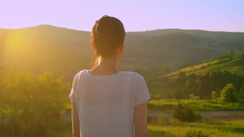 Woman Enjoys Mountain View at Sunset
