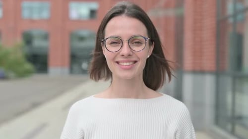 Young Woman Shaking Head as Yes Sign, Approval