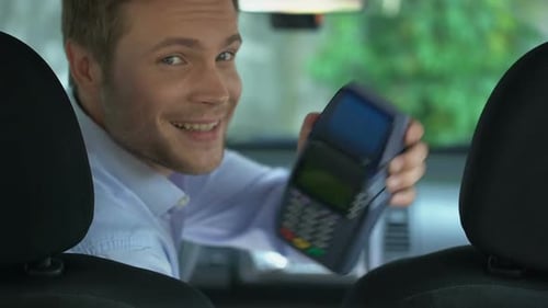 Handsome Taxi Driver Showing Payment Terminal, Contactless Transaction Service