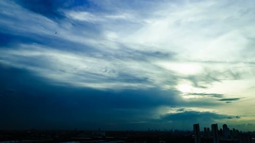 Time-Lapse Clouds Over City During Sunrise