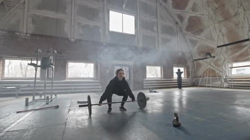Woman Lifting Weighted Barbell during Cross-Training