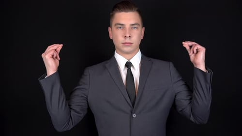 Young Man Celebrates a Success in Suit