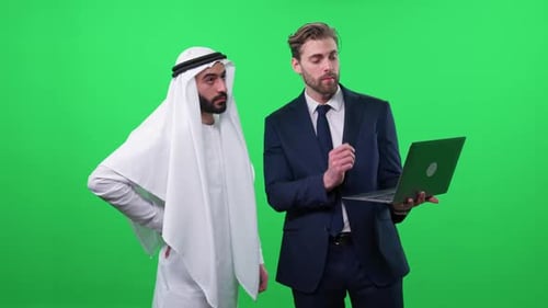 Two Men Discussing Business on a Laptop