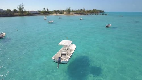 Aerial drone view of a fishing motor boat in the Bahamas, Caribbean
