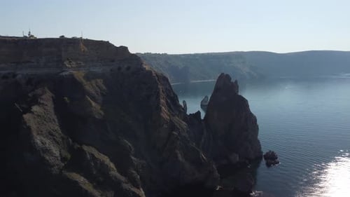 Aerial View From Above on Calm Azure Sea and Volcanic Rocky Shores