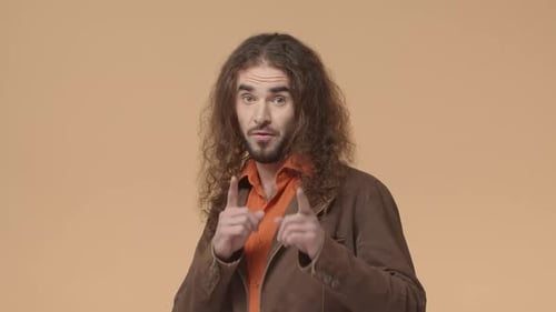 Young Adult Man Gives Approval Thumbs Up