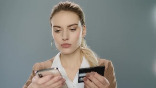 Blonde Woman Making Online Purchase on Phone