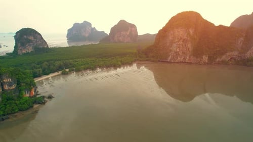 Aerial view over the coast, mountains and beaches during beautiful sunsets
