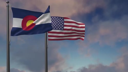 Waving Colorado State and United States Flags