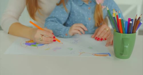 Child and Adult Drawing Together