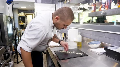 Cook in the Kitchen Restaurant Prepraring a Platter