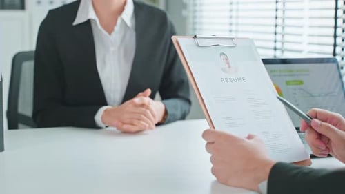 Close up of woman give resume to hr manager for job interview and apply job at office workplace.