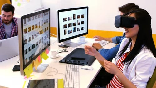 Team Collaborating with VR Headset in Workplace