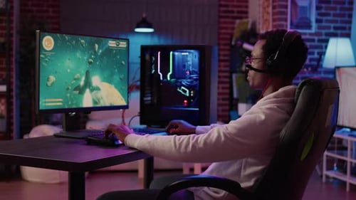 Young Adult Immersed in Video Game at Home