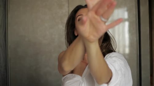 Young Woman with Creative Hand Movement