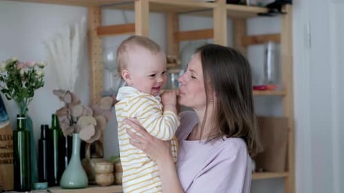Little Infant Child Laughing Having Fun and Looking in Camera