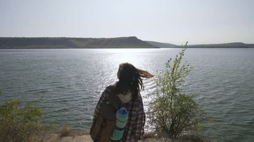 Female Tourist Walking with Backpack at Bakota Bay
