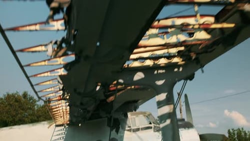 Demolished AN2 Plane Stands in Grass on Old Flying Field