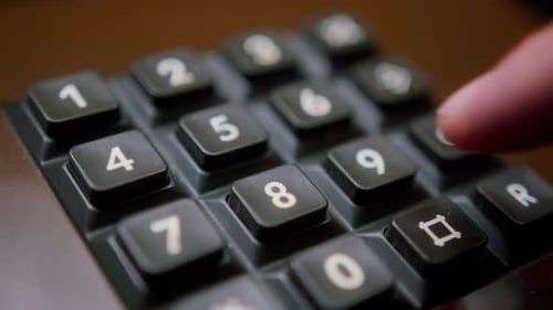 Dialing Number on Vintage Telephone Number Pad