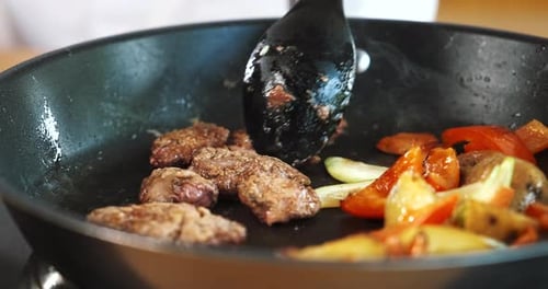Meat and Vegetables Cooking in Pan