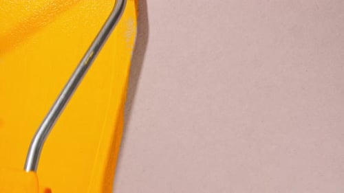 Abstract Brushstrokes of Yellow Paint Brush Roller Applied Isolated on a Gray Background