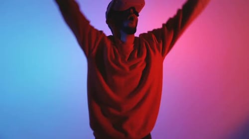 Man Wearing VR Headset Plays Video Game