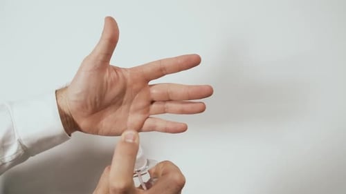 Hands Disinfecting With Hand Sanitizer Close Up