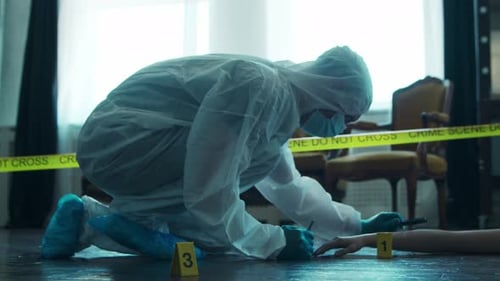 Forensic Investigator Examining Crime Scene Evidence