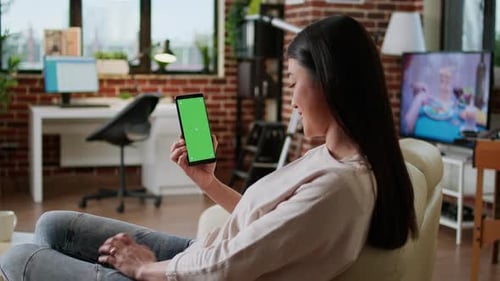 Happy Smiling Heartily Woman Having Smartphone with Green Screen Display