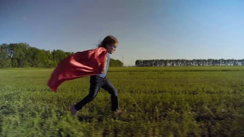 Little Girl Child In A Field In A Superhero Costume