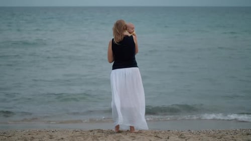 Mum with Baby Staring at the Sea