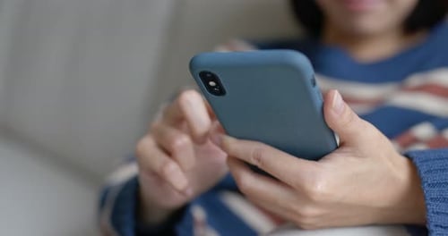 Person Using Mobile Cell Phone Close Up